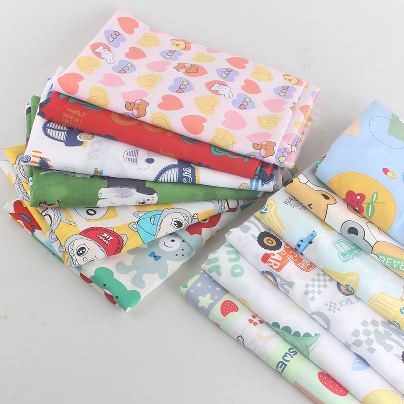 人造棉印花面料宝宝睡衣绵绸碎花连衣裙卡通床单棉绸府绸布料白底实物图