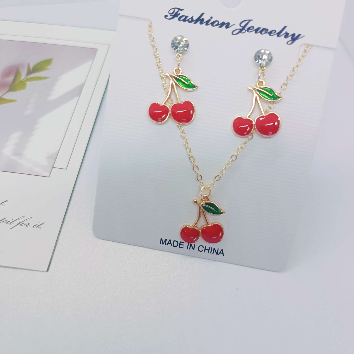 A set of fresh and sweet cherry earrings and necklaces from Amazon, a popular cross-border bestseller in Europe and America. The fruits are simple and fashionable, with oil drops and diamonds. Wholesale from the manufacturer Specification image