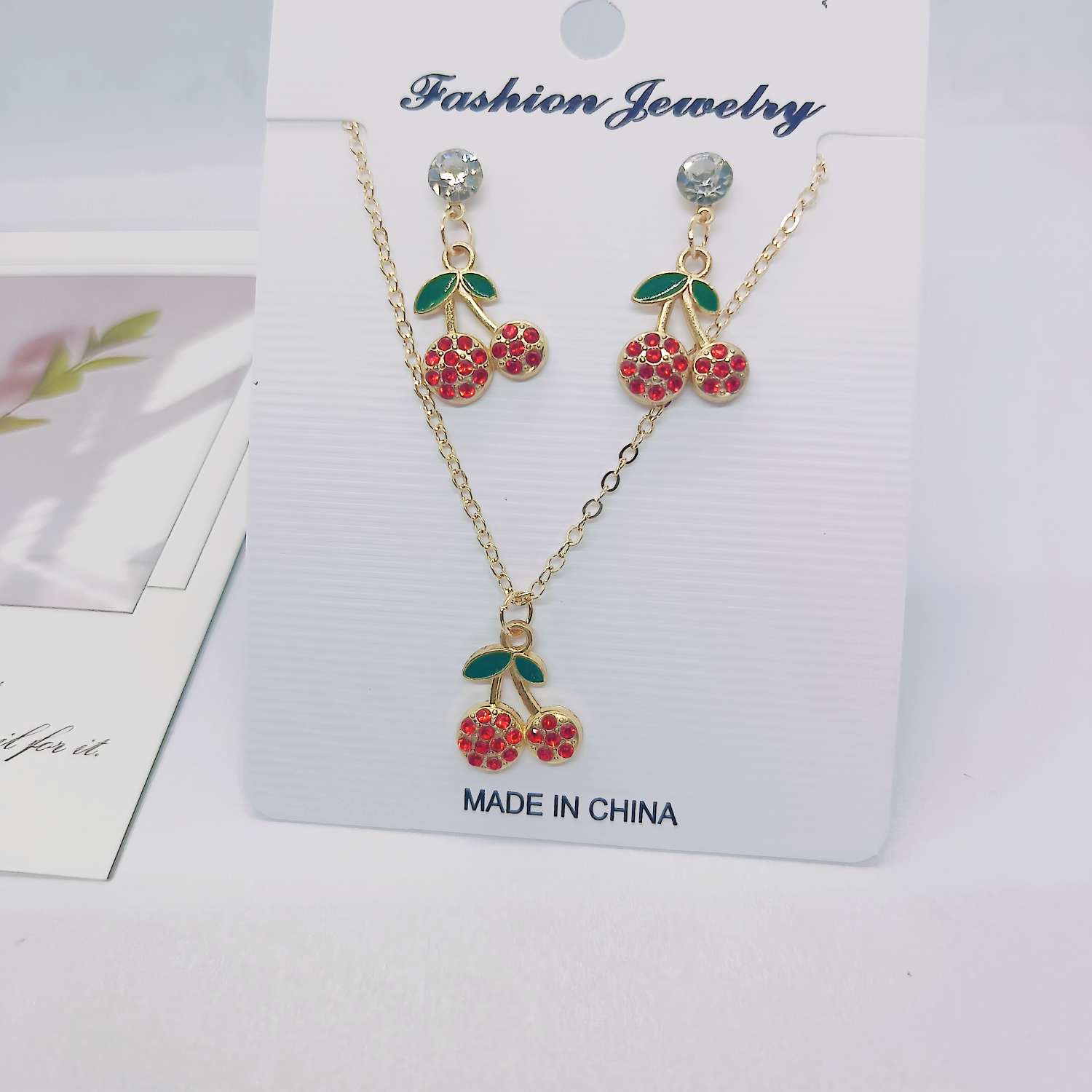 A set of fresh and sweet cherry earrings and necklaces from Amazon, a popular cross-border bestseller in Europe and America. The fruits are simple and fashionable, with oil drops and diamonds. Wholesale from the manufacturer details Picture