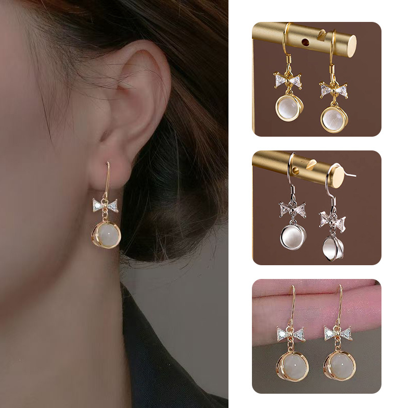 Xuhui brand Japanese and Korean small cat's eye stone earrings, ins style, high appearance level, zircon micro-inlaid bow ear hook earrings Item Picture