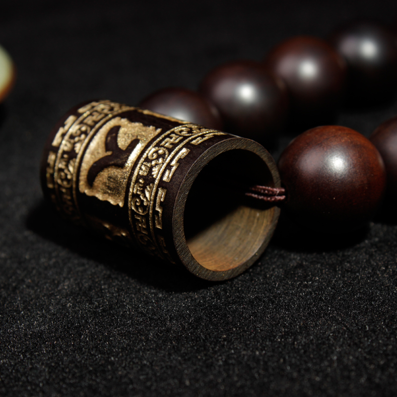 A light-struck jujube wood round bead is engraved through a gold barrel on a 13mm safe men's bracelet Application Scenario