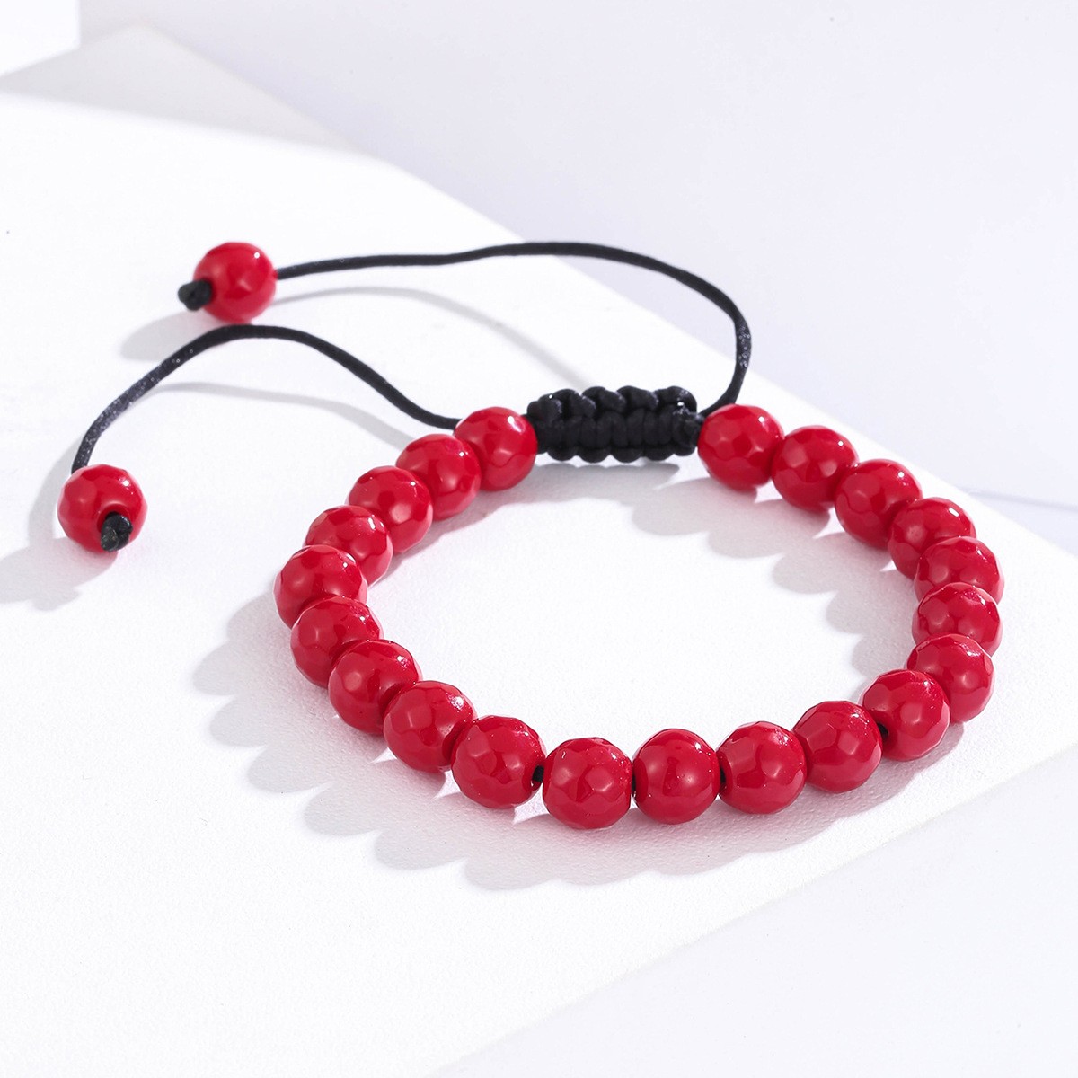 A versatile red natural stone beaded bracelet for both men and women, hand-woven with a high-end feel. Unisex Item Picture