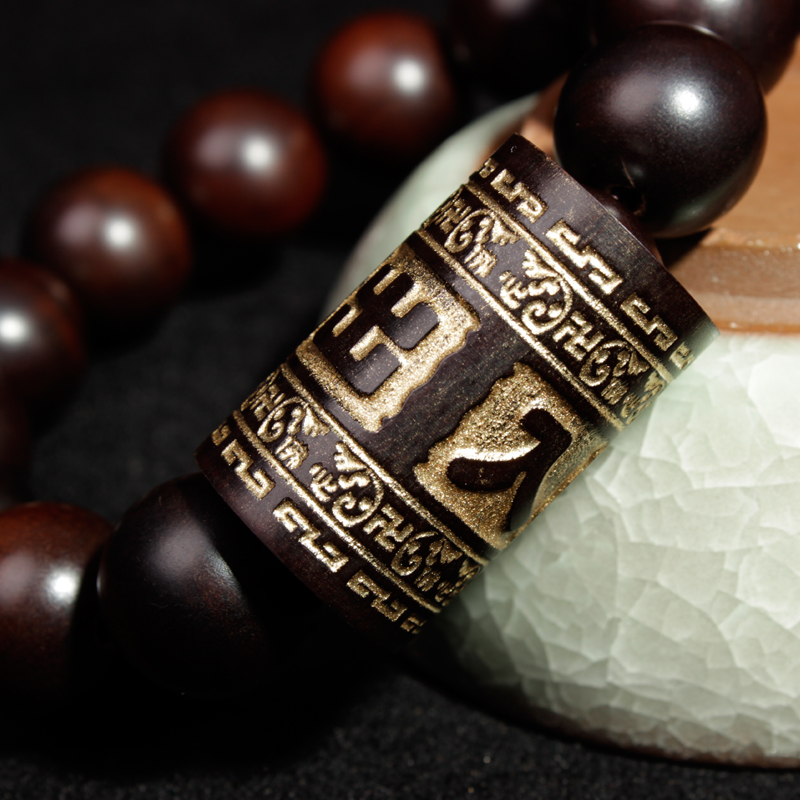 A light-struck jujube wood round bead is engraved through a gold barrel on a 13mm safe men's bracelet Specification image