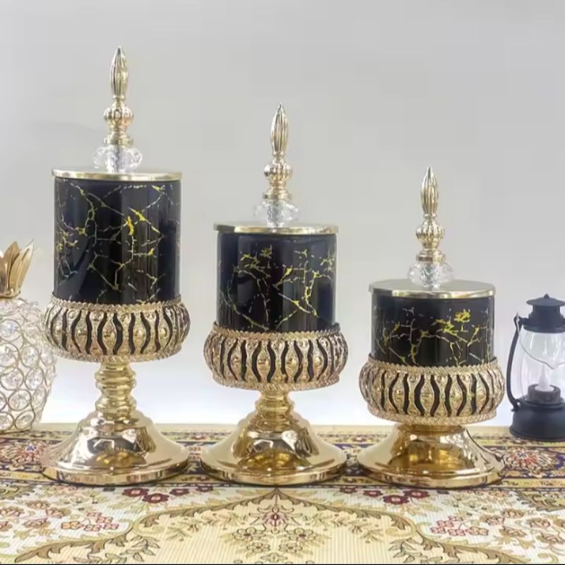 Decorative black glass storage jar with perforated metal base and gold lid luxury candy jar, perfect for home or office