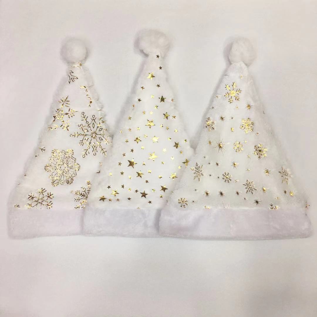 Christmas decorations: White Christmas hats with gold and silver prints and plush edges, adult Christmas hats