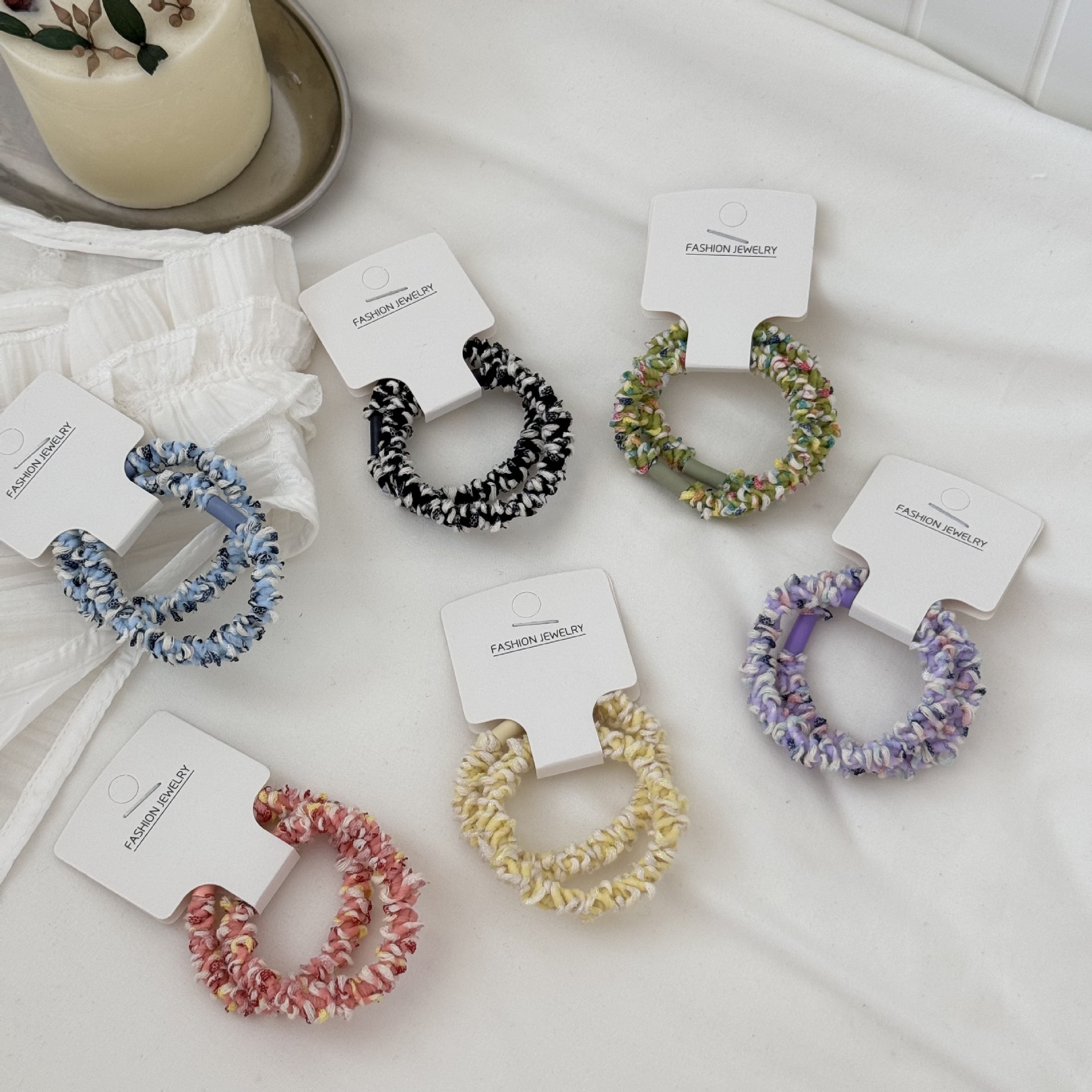 Two new styles of hair accessories featuring spiral woven high-elasticity rubber bands, durable rubber bands and ponytail hair ties that won't damage hair full figure