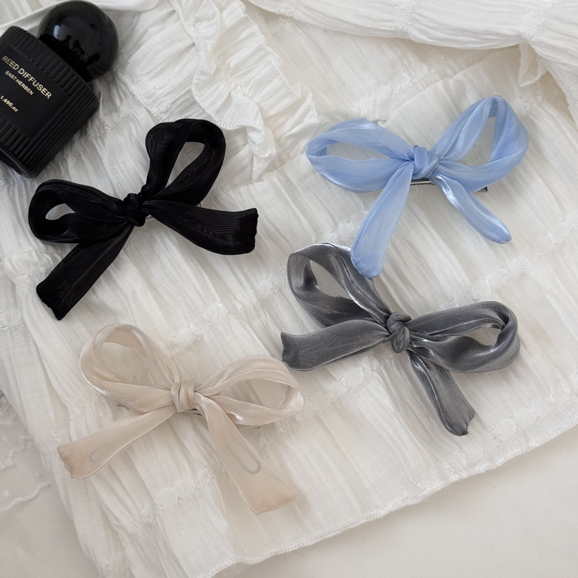 Korean ONI high-end glossy mesh fabric with a silky texture, bow bangs, and a half-tied hair clip at the back of the head for women details Picture