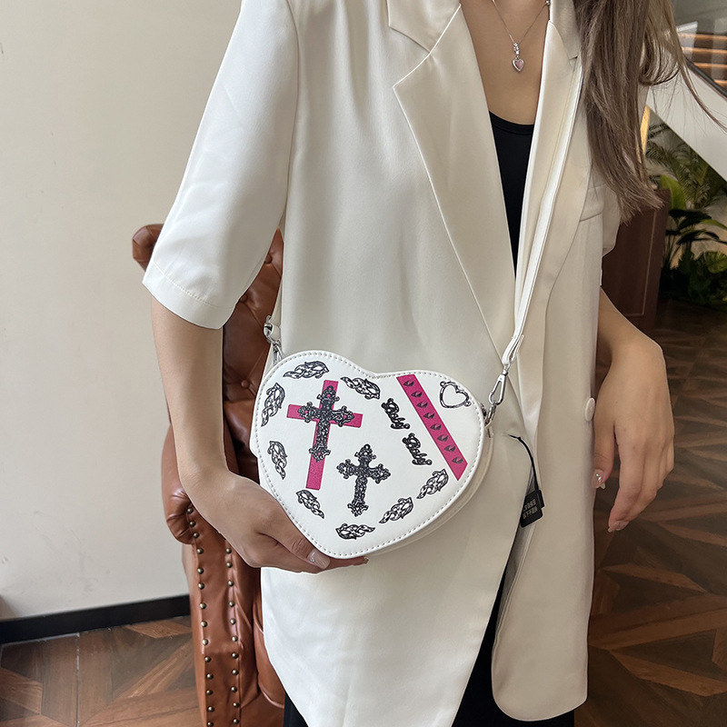 A trendy and versatile casual bag for women in 2025, a simple and stylish crossbody bag with a heart shape details Picture