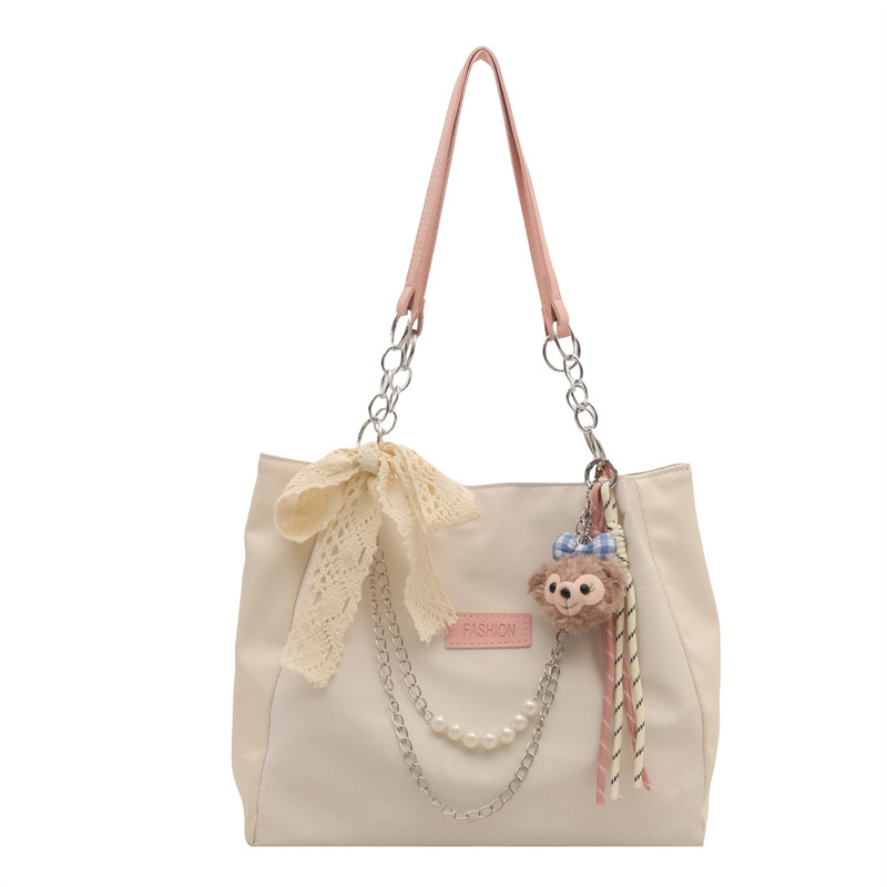 This is a new spring large-capacity tote bag for students' commuting to school, featuring a unique and elegant single-shoulder design for women Item Picture