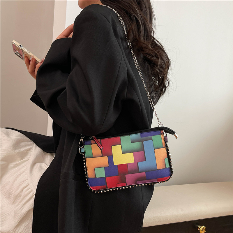 The checkered stylish handbag is a new, simple and fashionable underarm bag for women in 2025. It is a casual, color-blocking single-shoulder small square bag details Picture