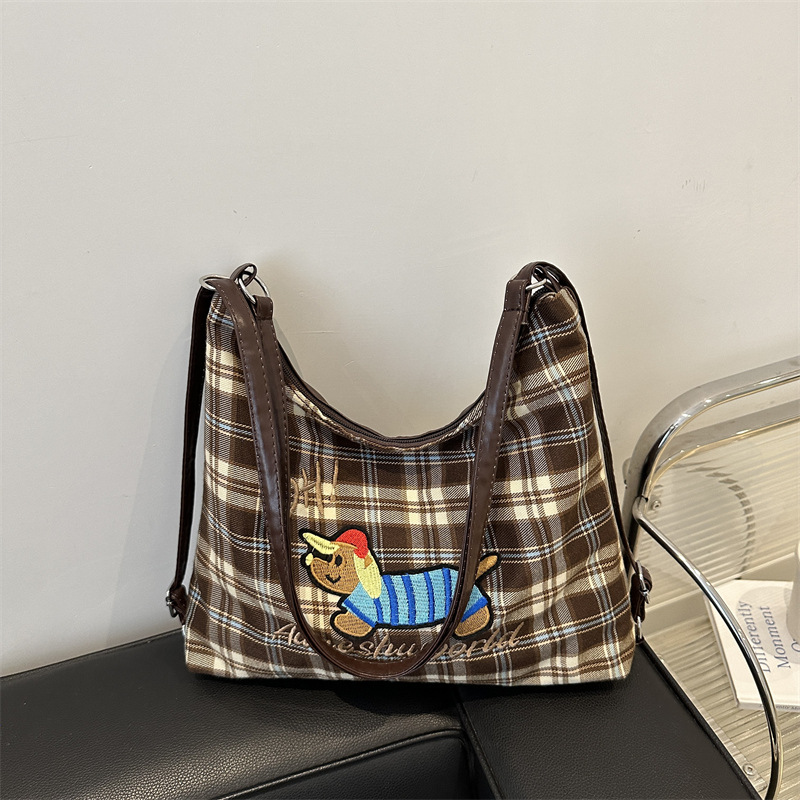 A new 2024 trendy and stylish backpack for women, featuring a cartoon checkered single-shoulder crossbody bag and a tote bag full figure