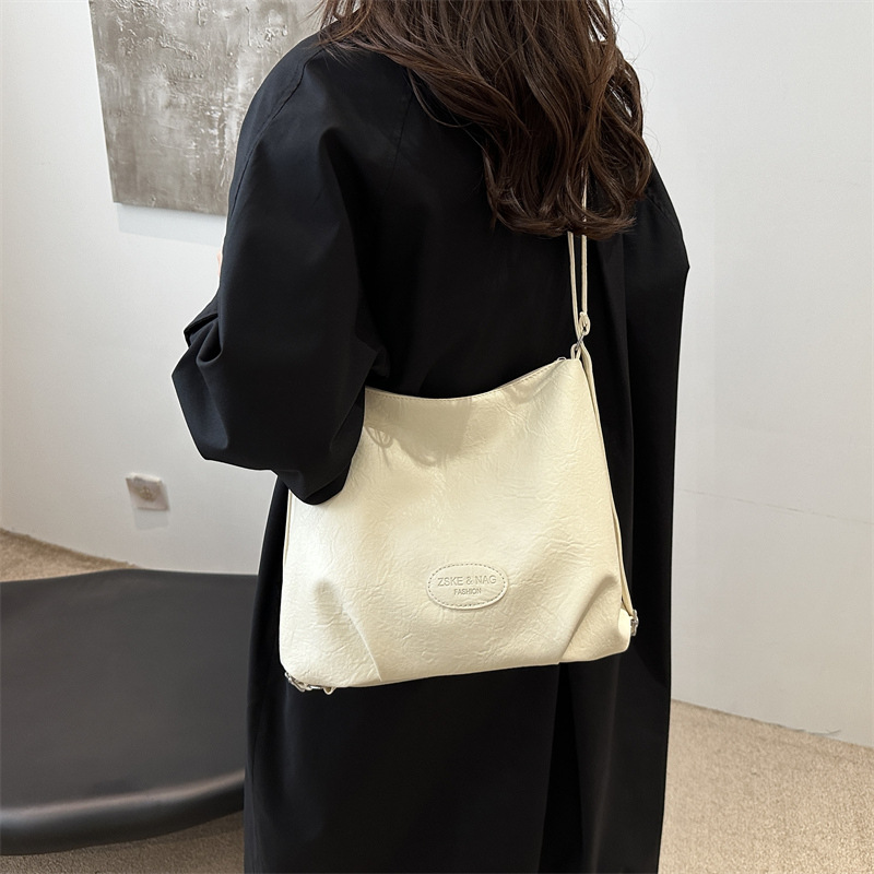 The 2024 new pleated tote bag is a large-capacity casual and fashionable backpack for women, featuring multi-functional texture and a single-shoulder crossbody bag details Picture