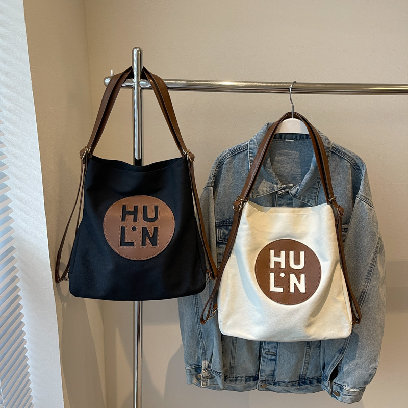 Korean letter printed multi-purpose cloth bag, 2024 new style, high-quality student backpack, commuting single-shoulder bag Application Scenario