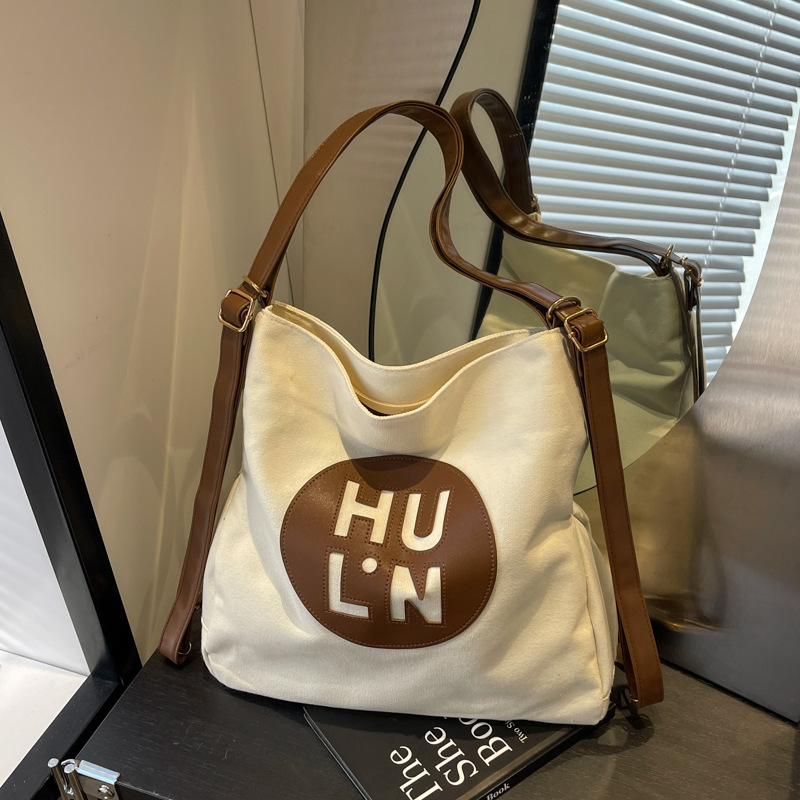 Korean letter printed multi-purpose cloth bag, 2024 new style, high-quality student backpack, commuting single-shoulder bag full figure