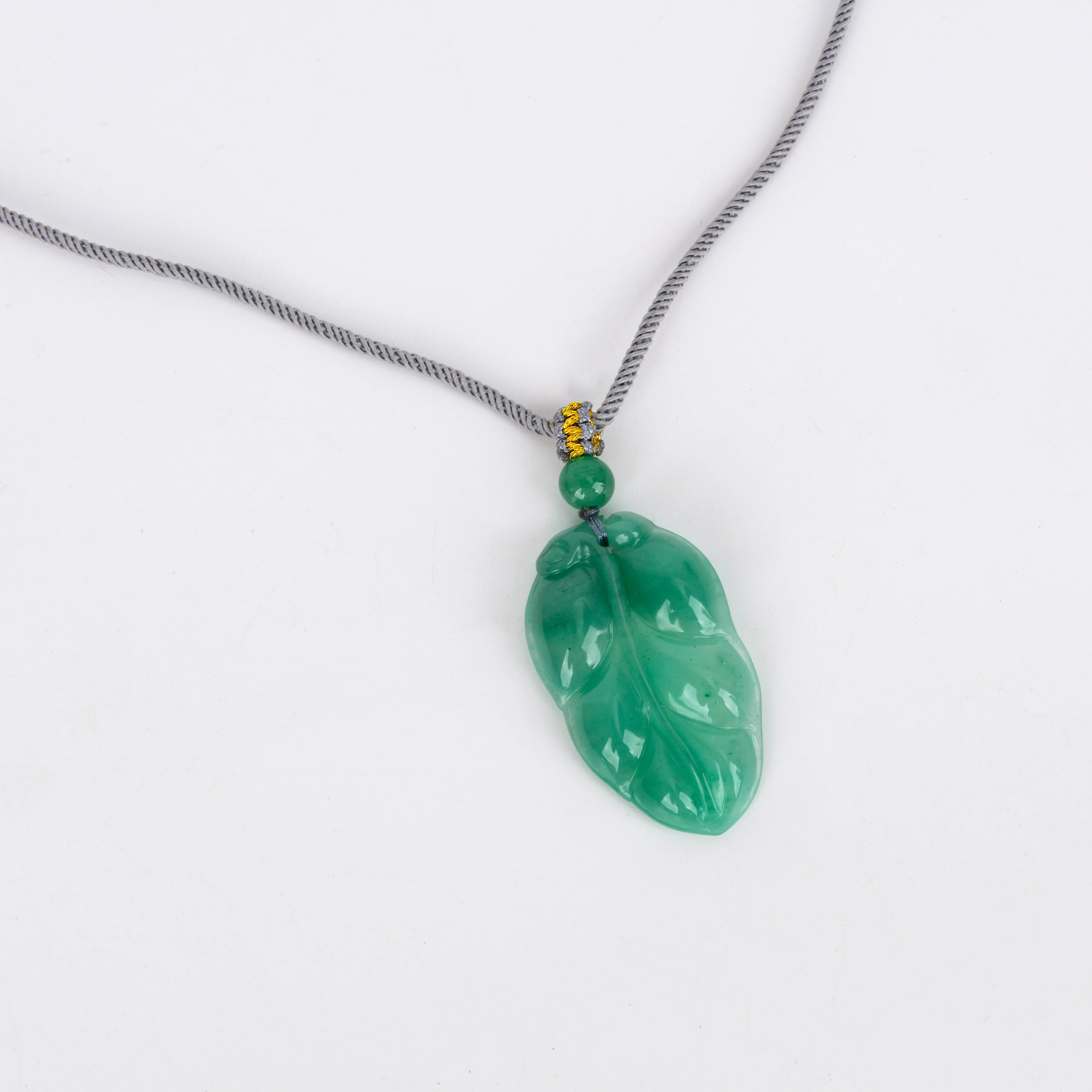 A small round thread is wound around a golden silk thread and tied flat to create an adjustable jade, agate, Hetian jade, amber and gold pendant necklace details Picture