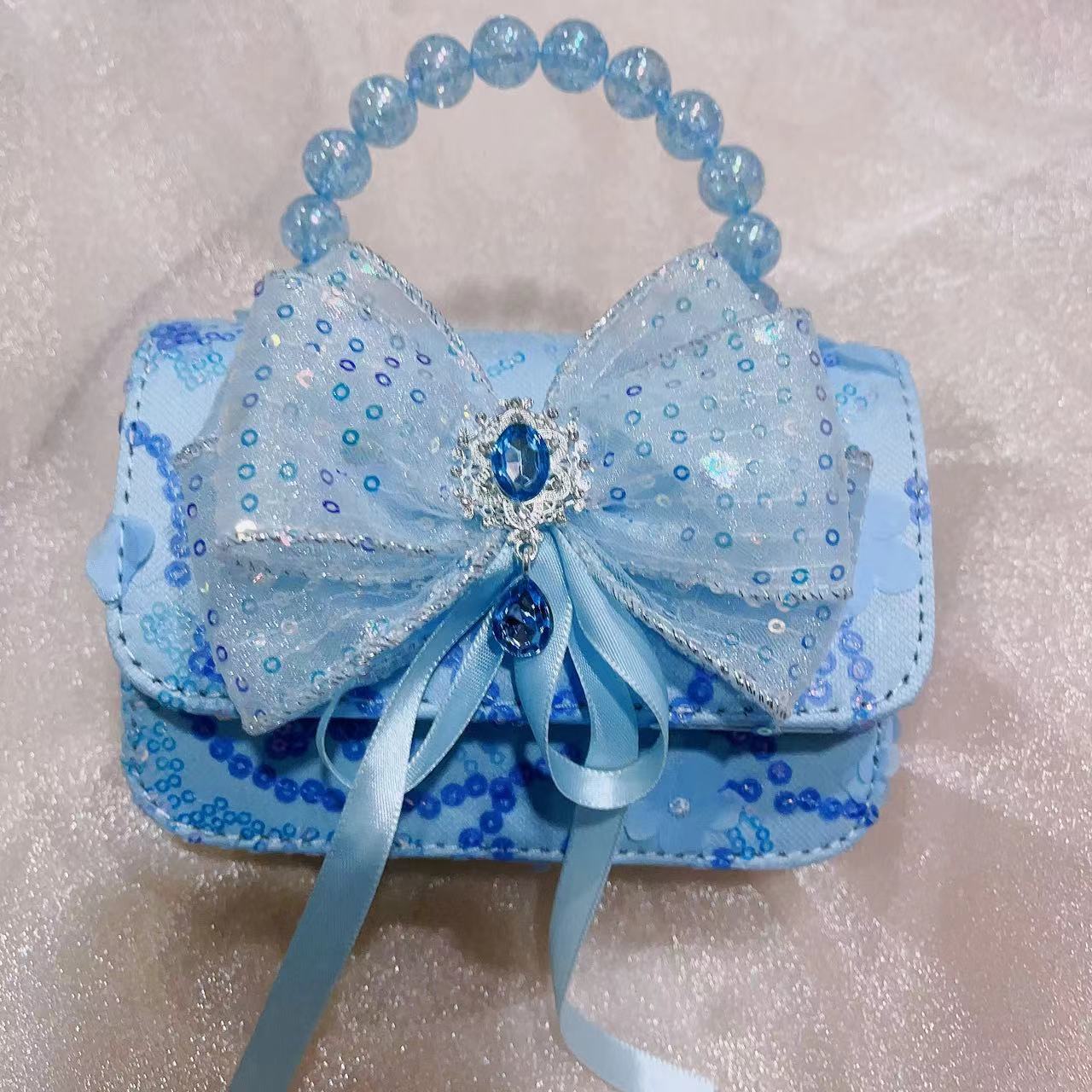 Korean-style fashionable pearl children's bag, little Chanel-style hand-held bag, pearl handbag, cute girl single-shoulder crossbody bag Application Scenario