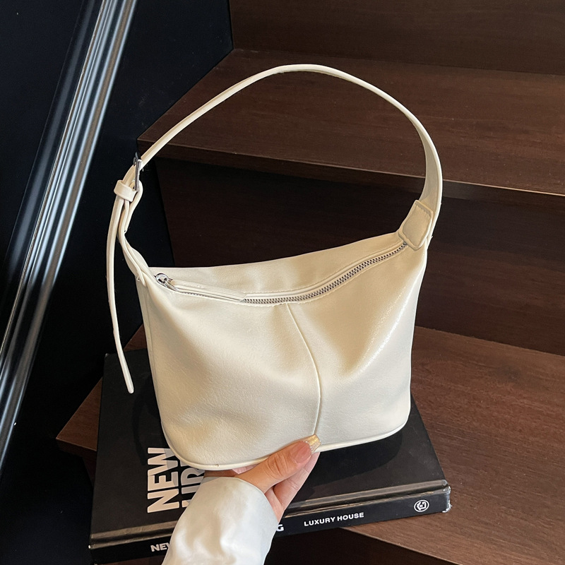 Korean commuter versatile underarm bag for women 2025 New summer fashion dumpling bag Niche single-shoulder crossbody bag trend full figure