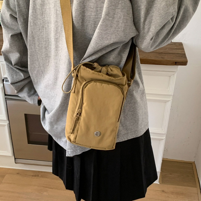 Outdoor portable casual mini single-shoulder bag, simple and versatile drawstring bucket bag, Korean style Instagram niche crossbody women's bag Specification drawing