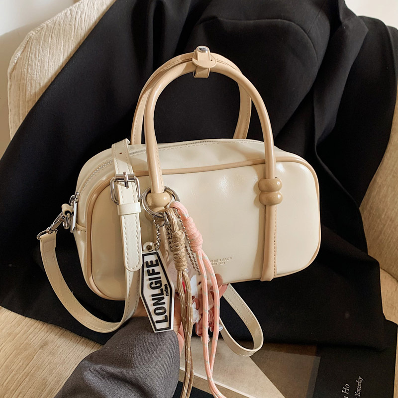Korean retro niche hand-held bowling bag, Spring 2025 new solid color single-shoulder crossbody bag, elegant handbag full figure