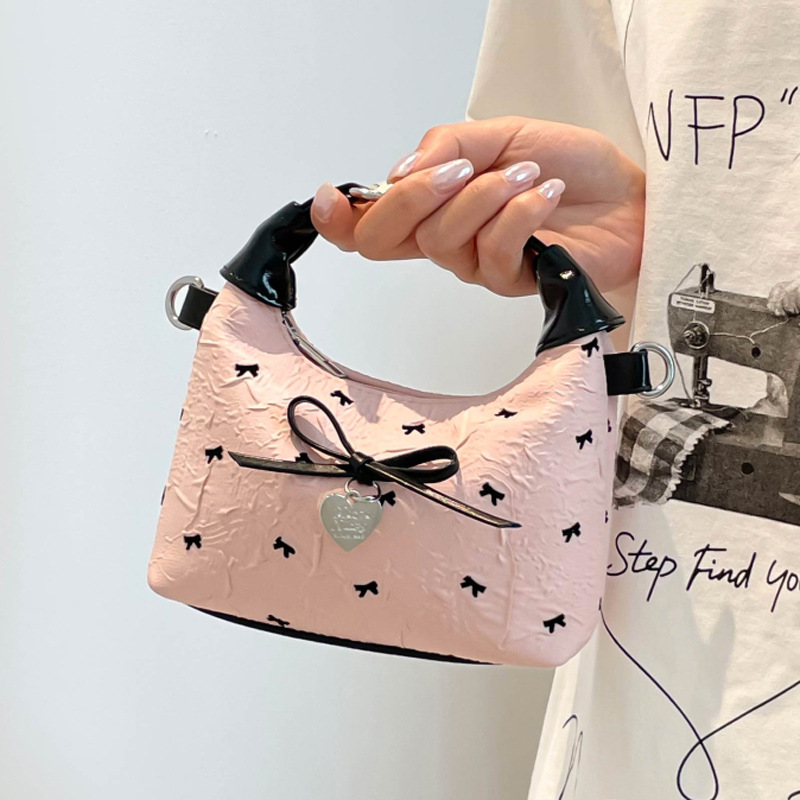 A versatile bow-shaped crossbody bag for women, a simple Korean-style handbag, a new summer 2025 fashionable dumpling bag Application Scenario