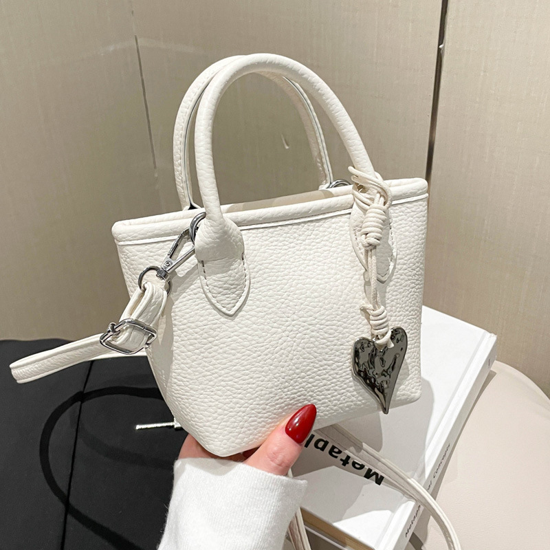 Simple and stylish hand-held bucket small bag for women, 2025 new Korean version single-shoulder crossbody bag, solid color commuting small handbag full figure