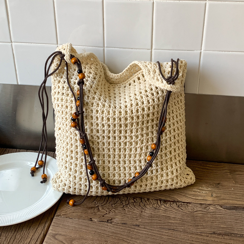 Summer woven beaded single-shoulder bag for women, large capacity, retro and fashionable, hollowed-out casual vacation style underarm crossbody bag full figure