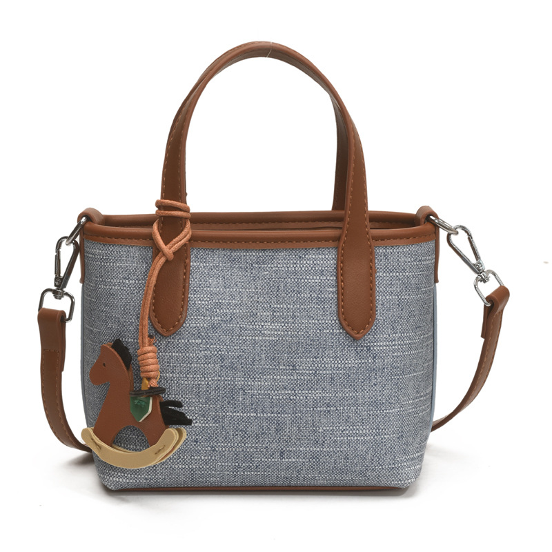 A simple and stylish hand-held bucket bag for women in the summer of 2025 with a Korean color scheme. It is a single-shoulder crossbody bag Item Picture
