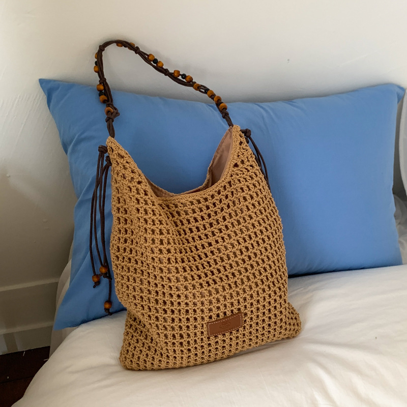 Summer hollowed-out woven large-capacity tote bag for women 2025, trendy and versatile, seaside vacation single-shoulder crossbody bag full figure