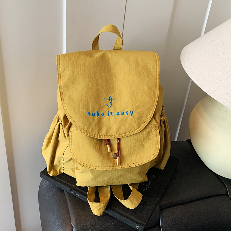 A new 2025 lightweight and versatile women's backpack made of nylon fabric for casual travel full figure