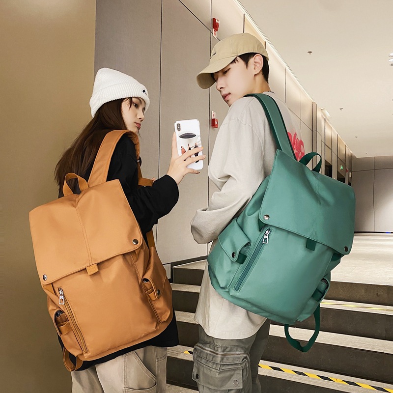 New solid-color computer backpack for men, college style, flip cover casual schoolbag for college students, high school campus backpack for women full figure