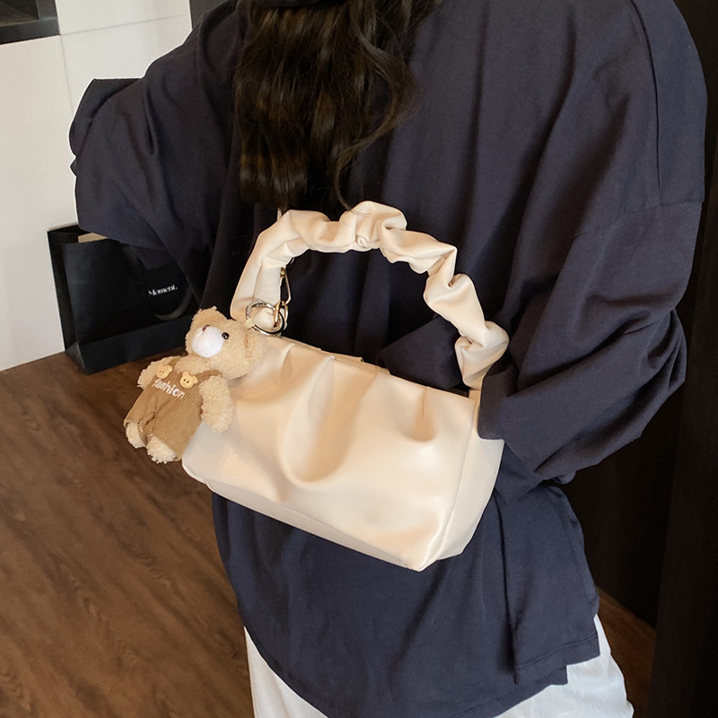 A simple and casual pleated hand-held shoulder bag for women in the summer of 2025, with a stylish and niche look, is a cross-body commuting bag details Picture