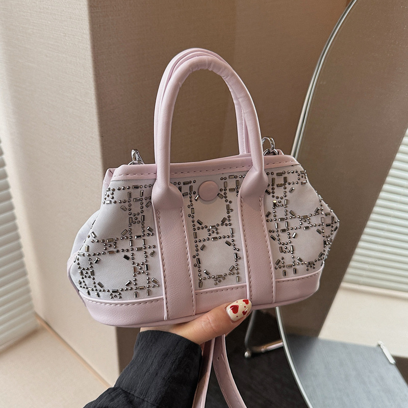 Korean minimalist, versatile and niche hand-held bucket bag for women, a new summer 2025 fashion single-shoulder crossbody bag trend full figure