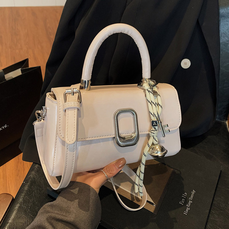This is a new spring 2025 casual bag for women. It features a trendy and simple hand-held small square bag with a niche design and a commuting crossbody bag details Picture