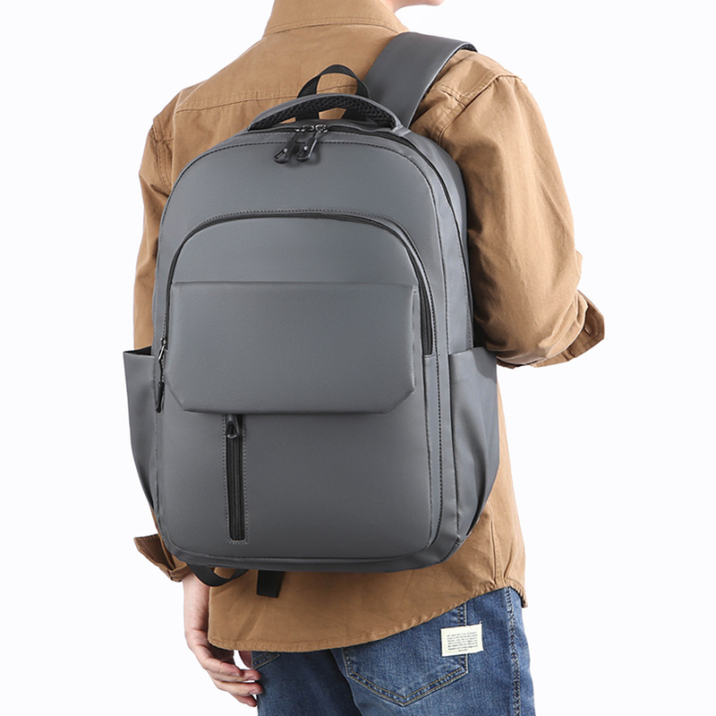 Wholesale of in-stock commuting and business backpacks for men, simple and large-capacity USB charging laptop bags, and student schoolbags details Picture