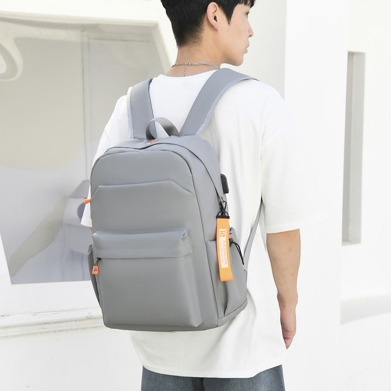 2023 New leather film backpack Summer Trend Men's and women's large-capacity student computer bag school bag Application Scenario