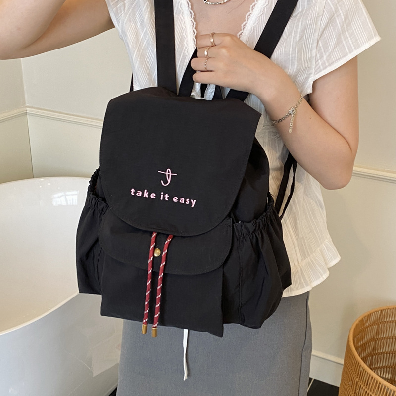 A new 2025 lightweight and versatile women's backpack made of nylon fabric for casual travel details Picture