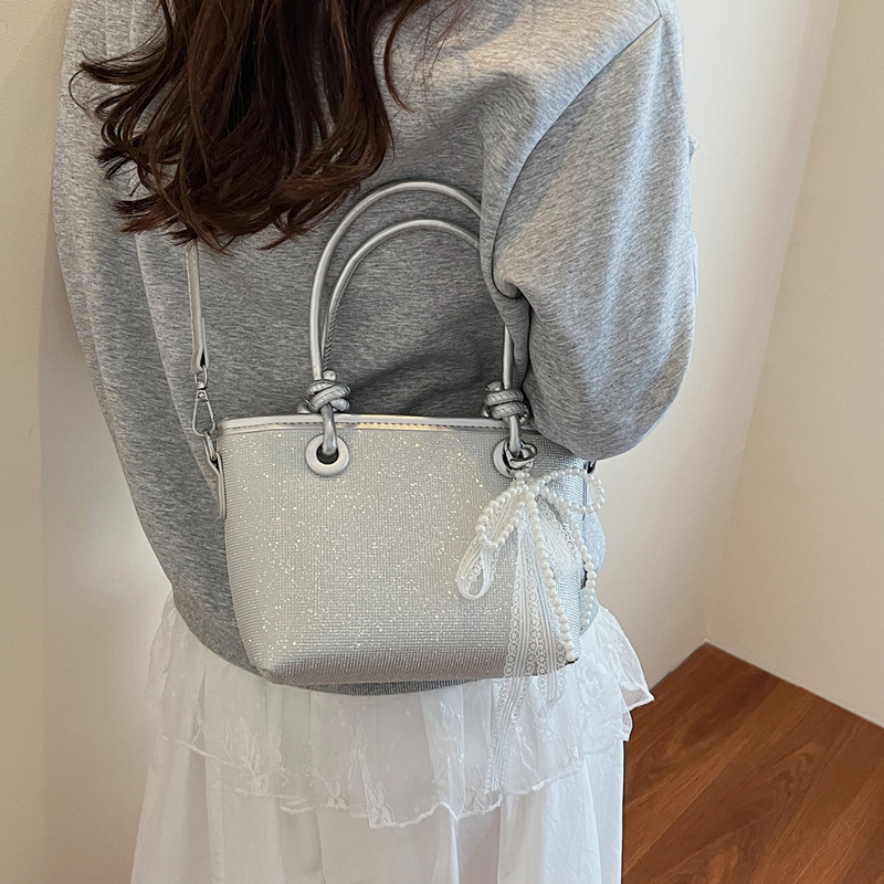 Niche design summer bag, women's hot diamond sequined hand-held bucket bag, 2025 new style bow pendant crossbody bag details Picture