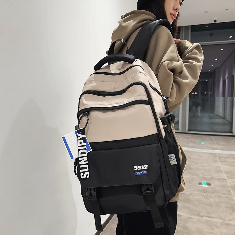 A new color-blocking computer backpack for girls in the college style, a large-capacity backpack for boys in street fashion details Picture