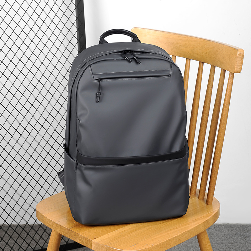 A new minimalist backpack for men, a Korean-style casual and fashionable backpack for laptops, with a logo printed on it details Picture