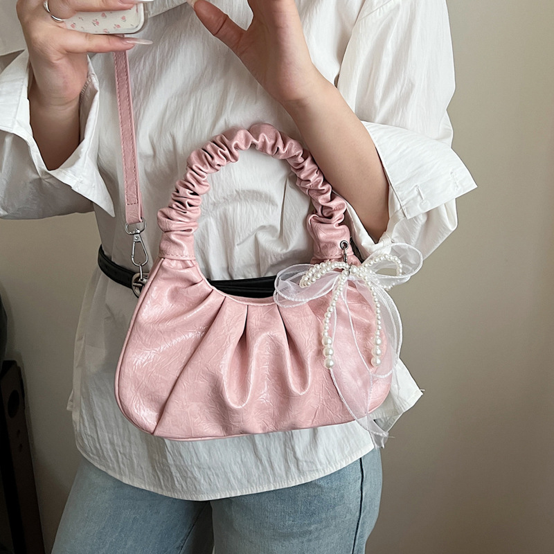 A new summer fashion single-shoulder crossbody bag for women with a niche design in 2025, featuring a casual Korean-style pleated dumpling bag details Picture