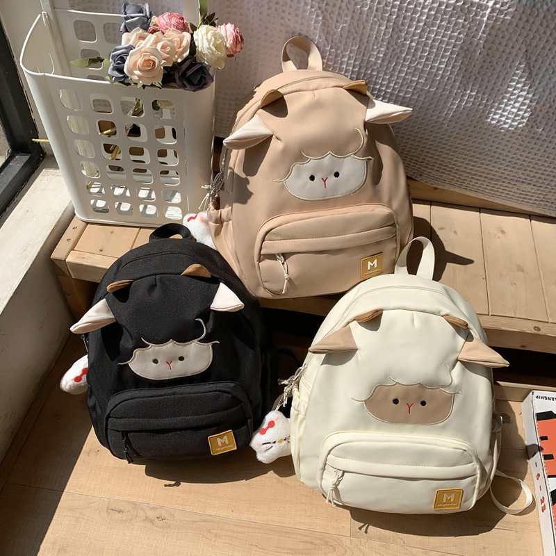 Cute little lamb schoolbag, fashionable backpack for female college students, high school girls' appearance level, large-capacity backpack for junior high school students' travel, a trend full figure