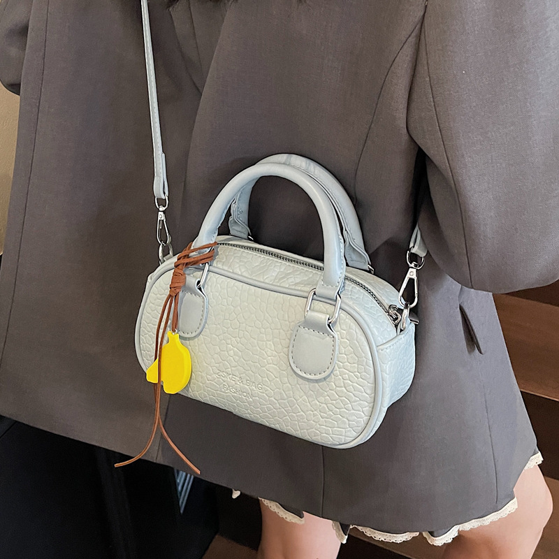 In the summer of 2025, this is a fashionable and stylish new single-shoulder bag with a niche design. It is a small round crossbody bag for women's commuting Application Scenario