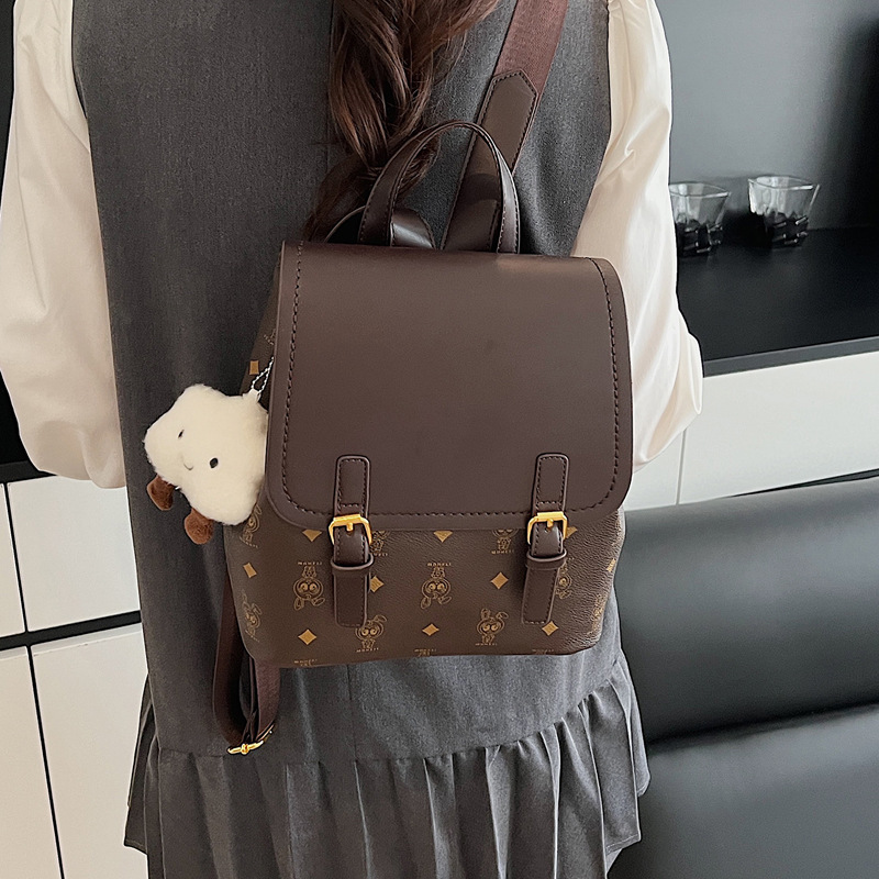This is a niche design for women, featuring cartoon animal prints. It is a pink backpack with a high level of appearance and large capacity for travel details Picture