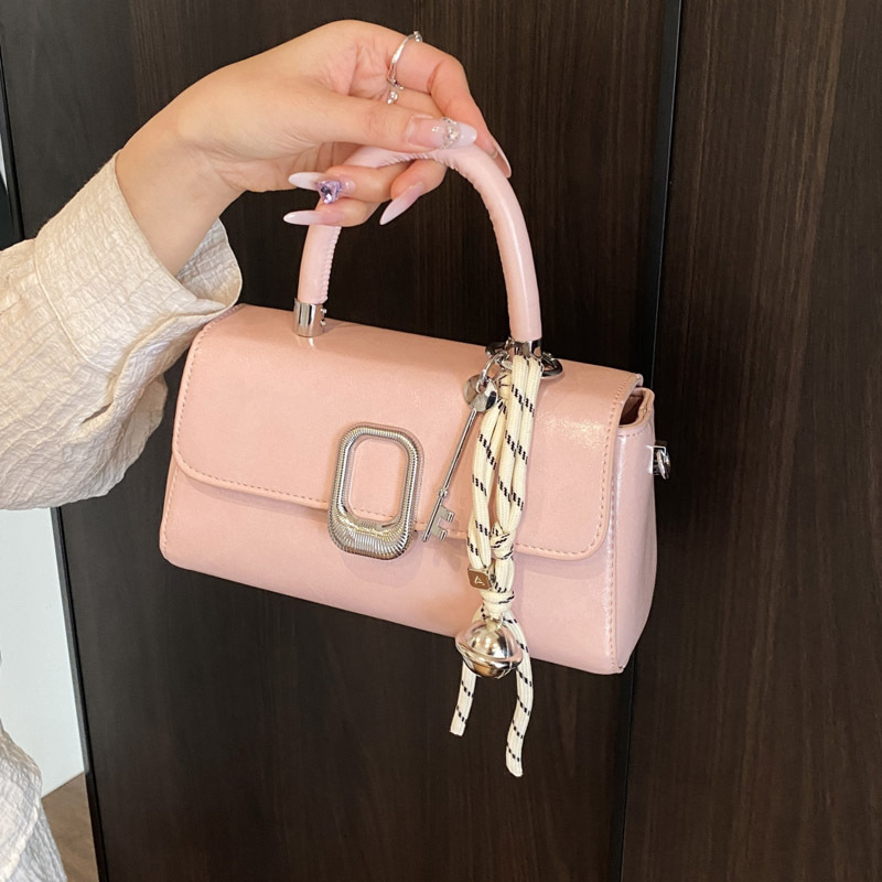 This is a new spring 2025 casual bag for women. It features a trendy and simple hand-held small square bag with a niche design and a commuting crossbody bag full figure