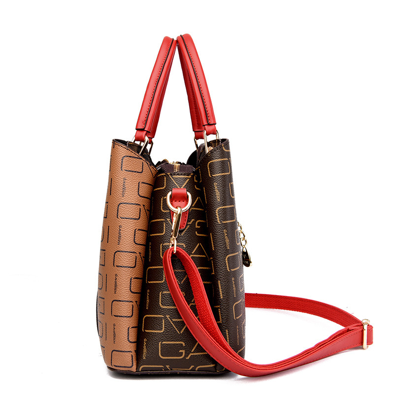 The 2023 new women's bag with a patchwork geometric design is a simple and versatile handbag for middle-aged mothers with a large capacity and a single shoulder bag for women details Picture