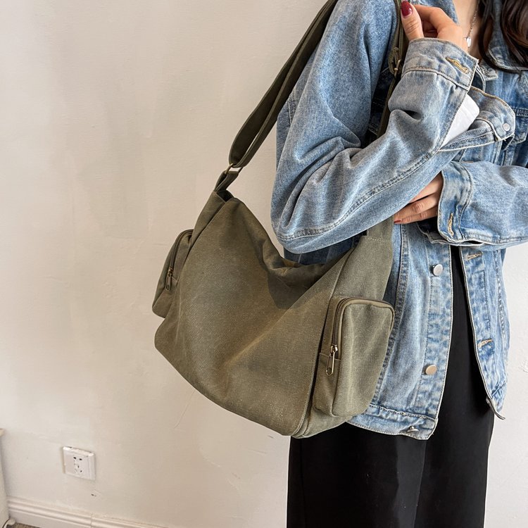 A large-capacity women's 2025 new Korean-style simple canvas bag, a fashionable large-capacity crossbody tote bag full figure