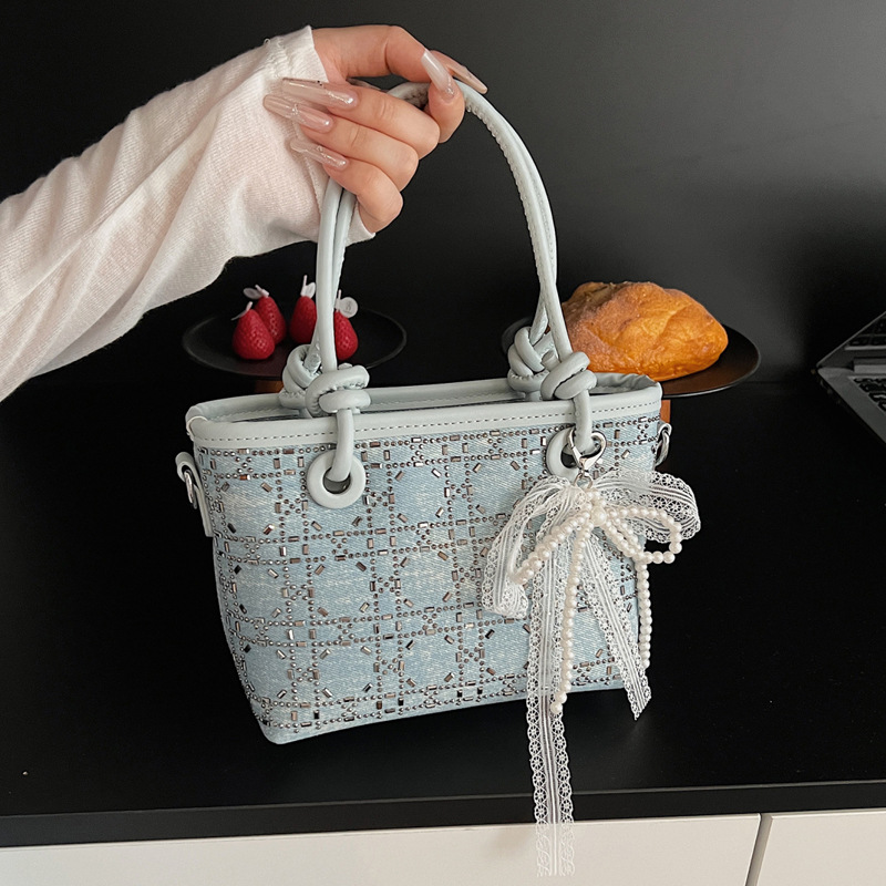 Niche design summer bag, women's hot diamond sequined hand-held bucket bag, 2025 new style bow pendant crossbody bag full figure