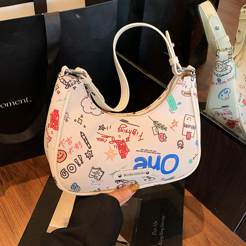 Cool graffiti small bag for women 2025 New style, fashionable and textured crescent-shaped underarm bag, simple summer commuting single-shoulder bag full figure