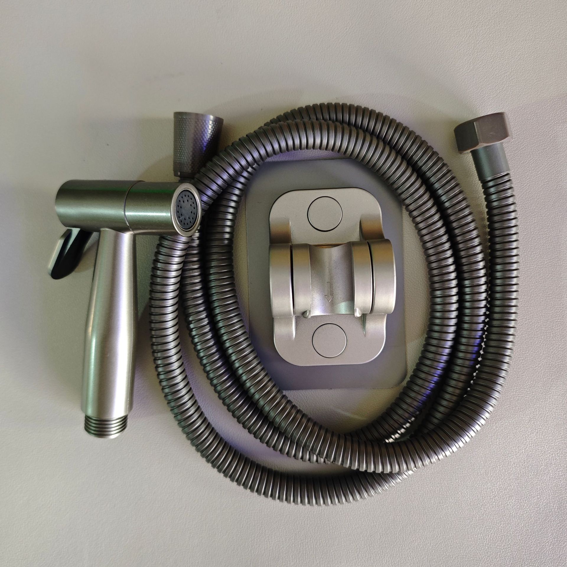 Grey high-pressure spray gun companion, bathroom flushing, handheld nozzle, toilet, feminine wash, small showerhead details Picture