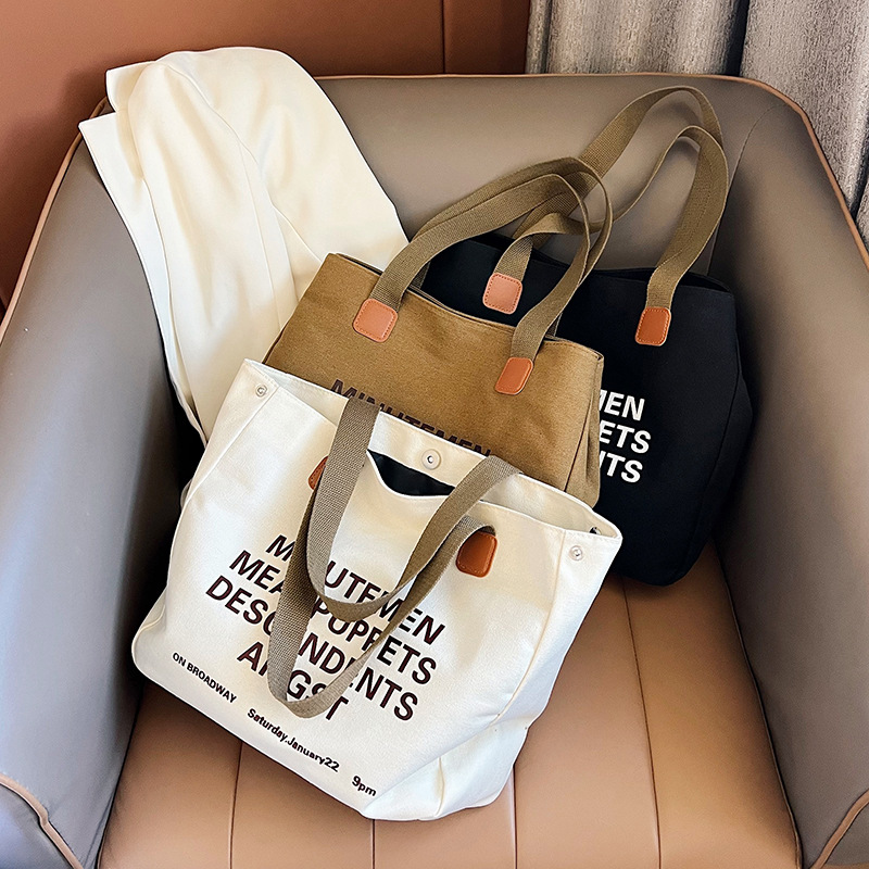 A new large-capacity canvas bag for students' school commute and travel, simple and versatile, crossbody hand-held canvas bag details Picture